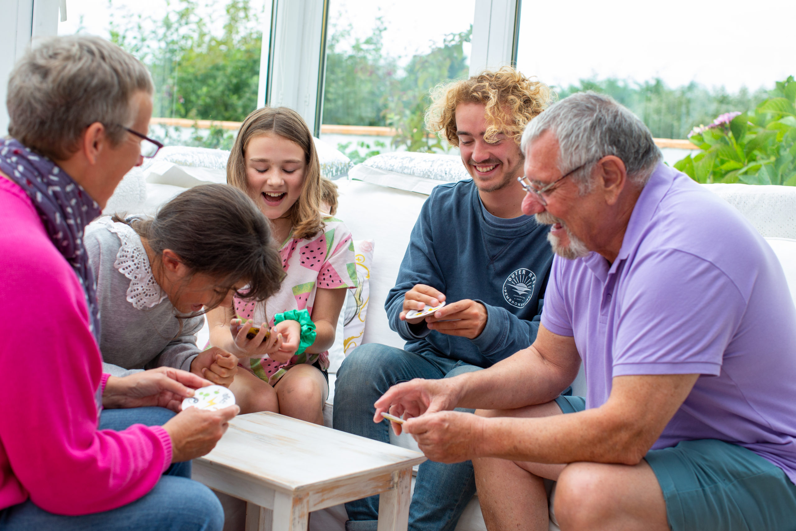 Family playing a card game
